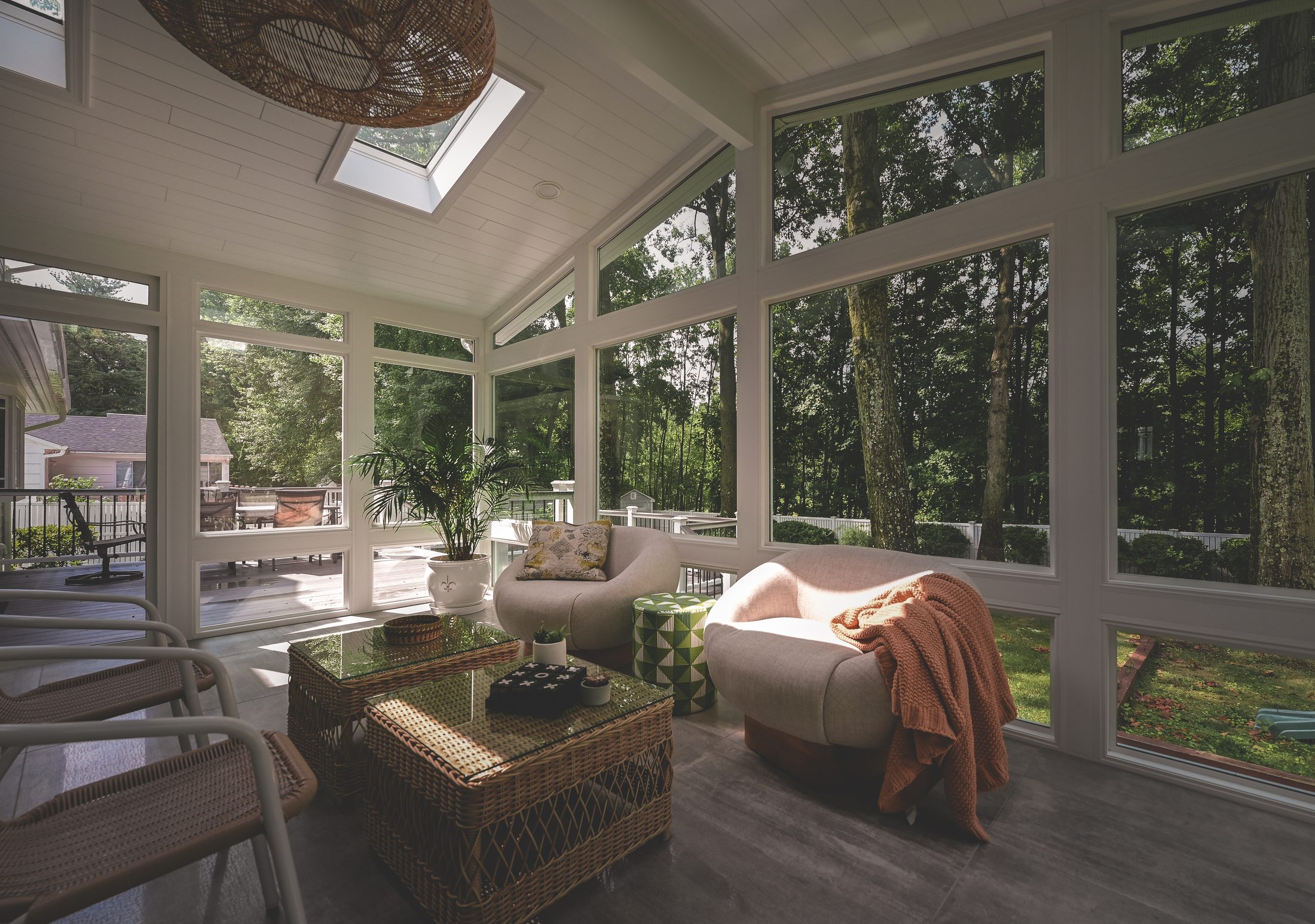 Finished four-season LivingSpace sunroom in golden afternoon light, South Jersey residential setting